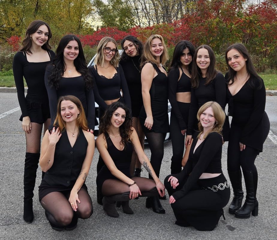 The Collective, gathered outside in the fall