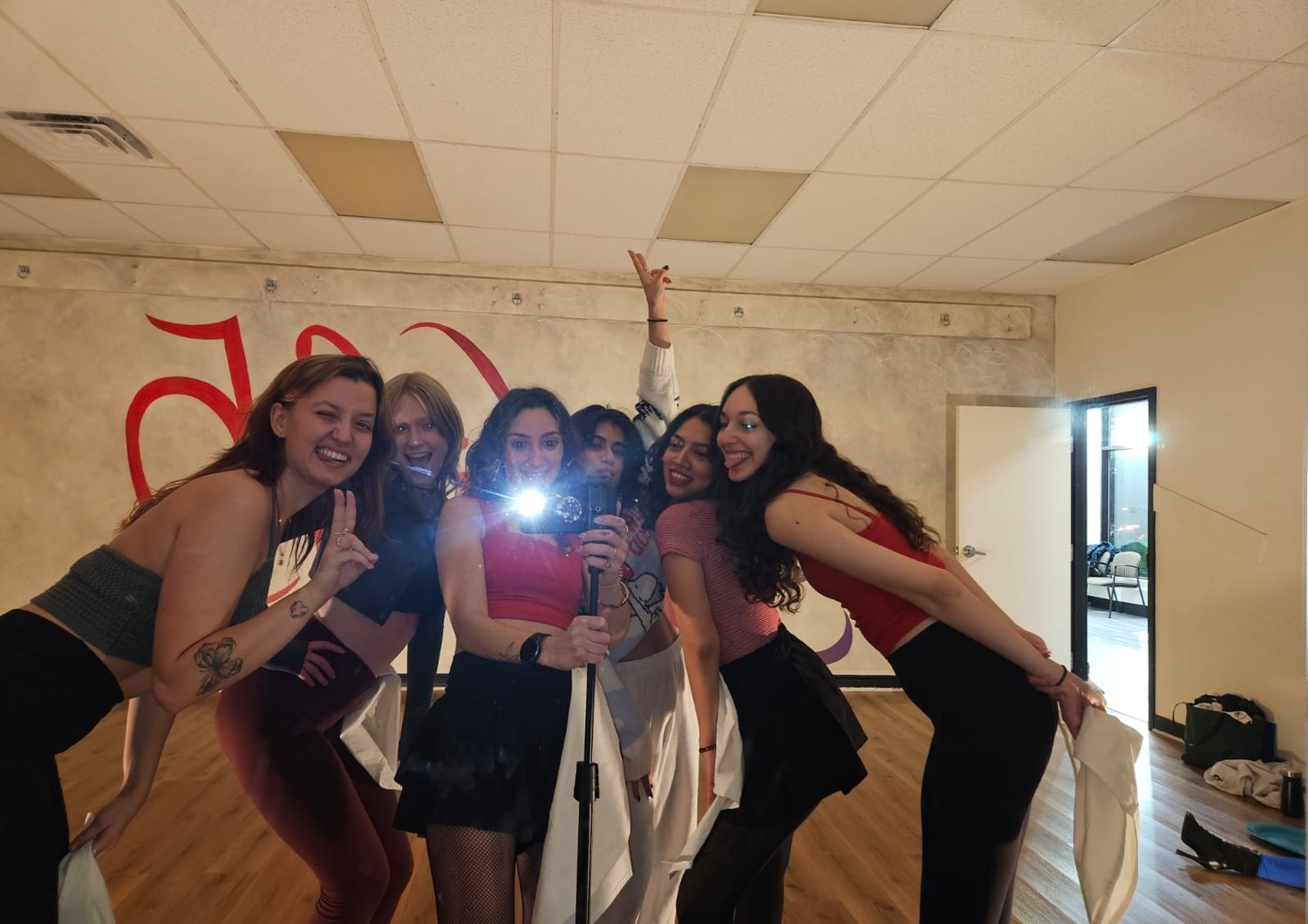 A class selfie on a red-lit night