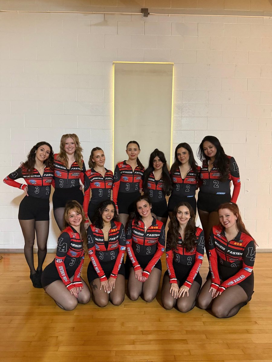 The team in matching racing costumes