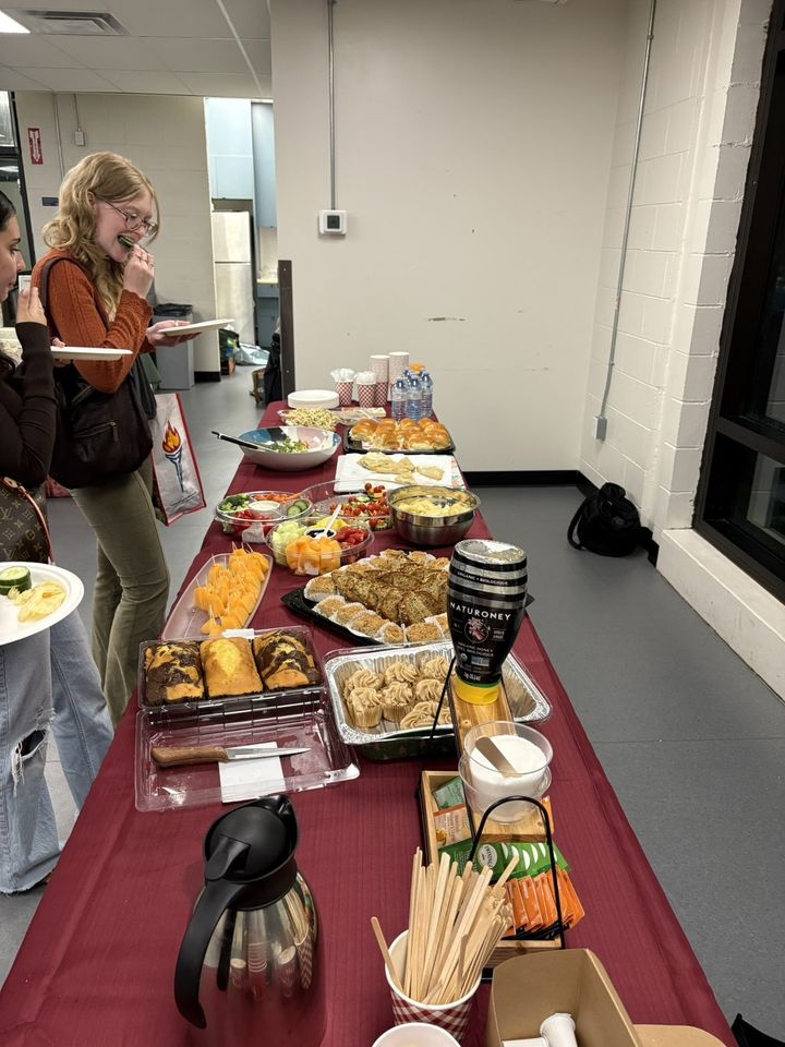 A guest helping herself at the buffet table